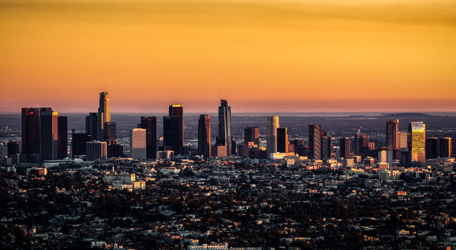 Los Angeles skyline at sunset from a hillside overlook