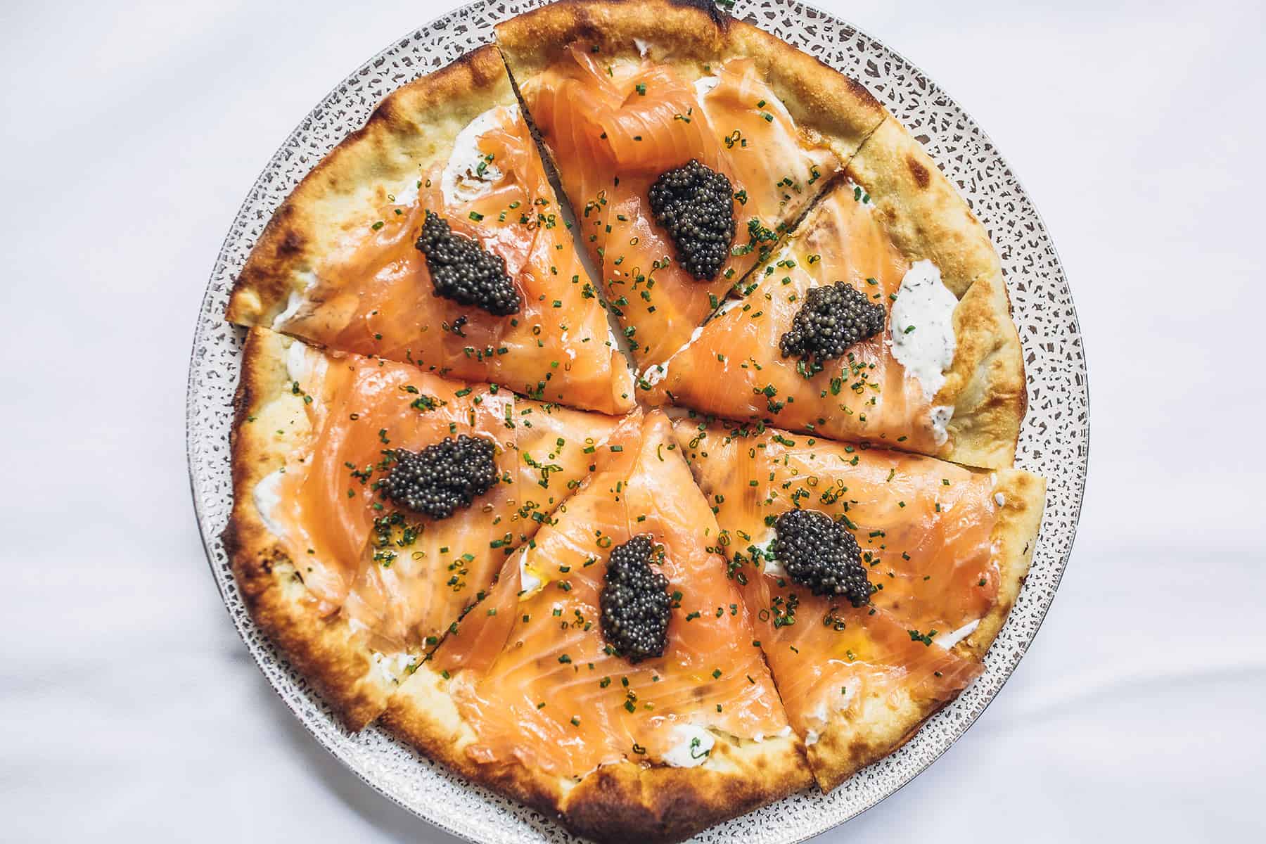 Smoked salmon and caviar flatbread, a signature dish in the style of Spago Beverly Hills