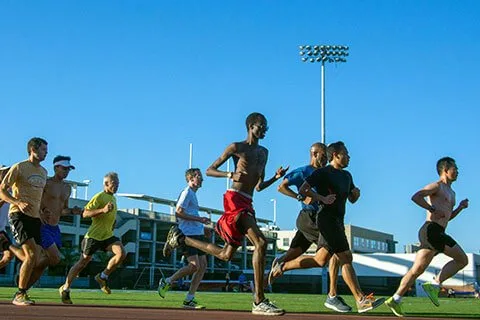 Runners at a Track Club LA group workout on the Santa Monica High School track.