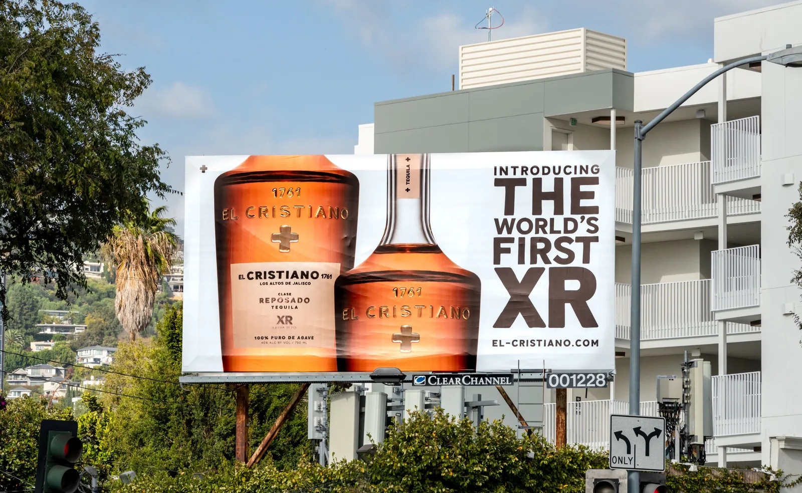 A billboard in front of the Hollywood Hills for El Cristiano's Clase Reposado XR tequila