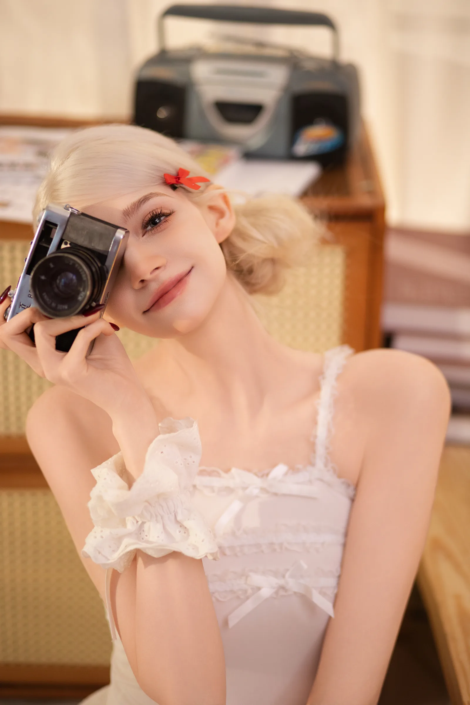 Ariana Hardie posing with a camera
