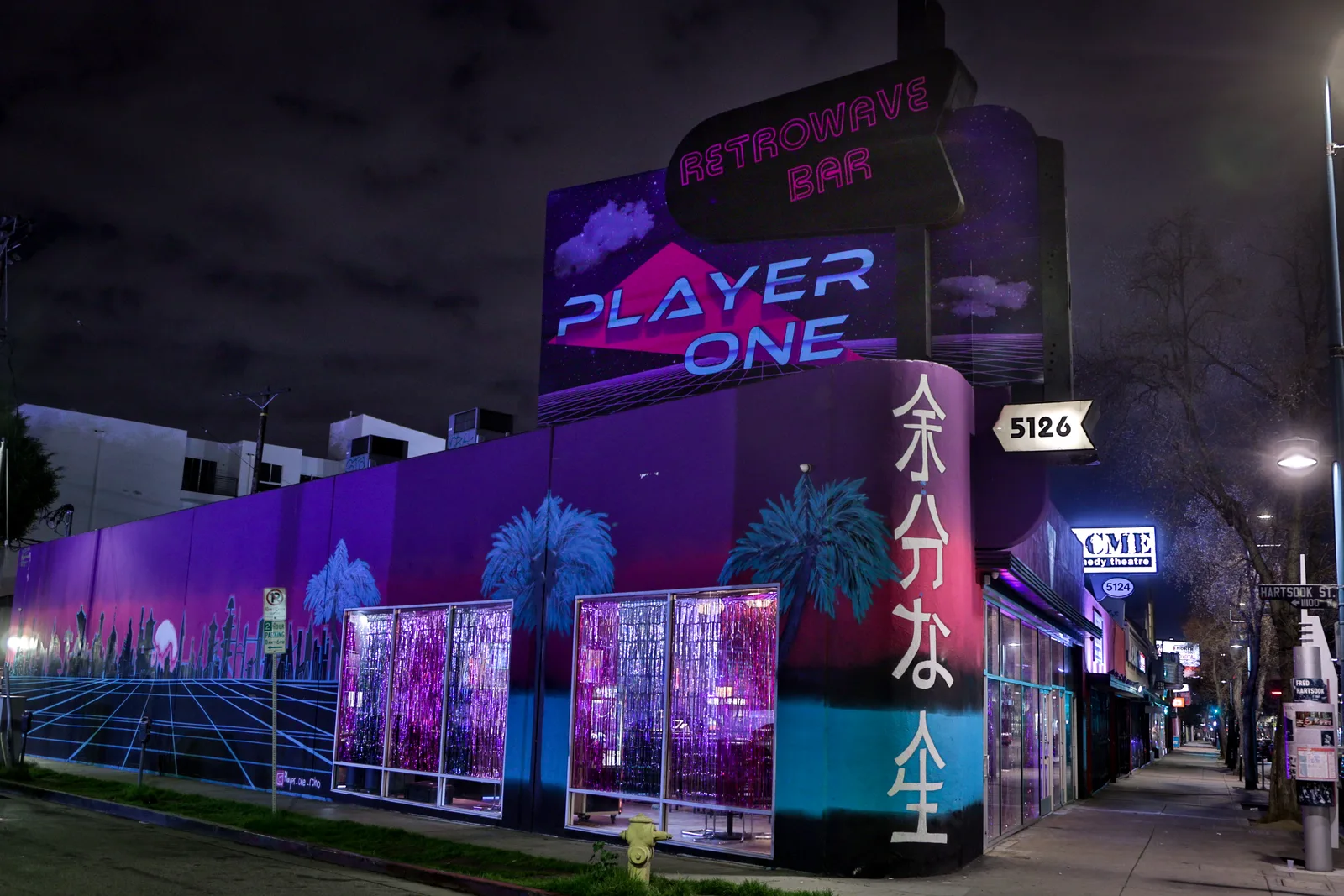 Neon-lit exterior of Player One Arcade Bar in NoHo