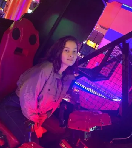A player in an arcade shooter game at the Glendale alley