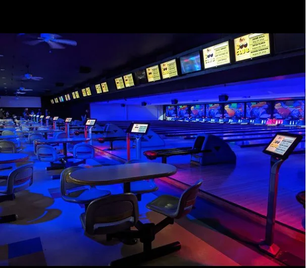 Blue lighting over empty bowling lanes at Gage Bowl
