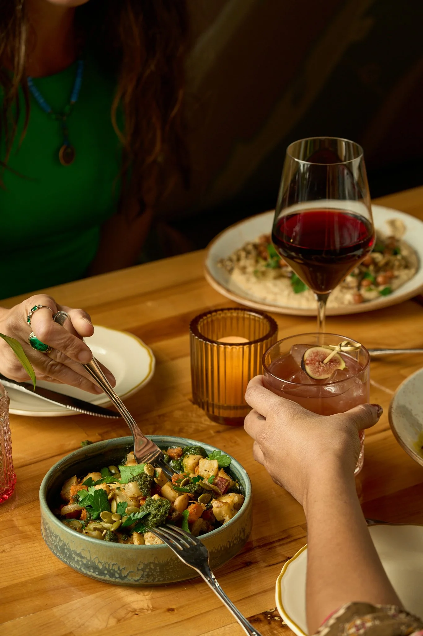 Shared plant-forward dinner and cocktails at The Butcher's Daughter