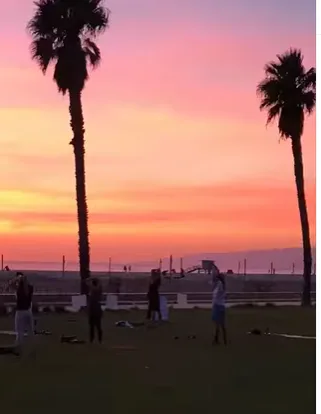Outdoor yoga and HIIT class at Barnard Way Linear Park in Santa Monica with DMN8