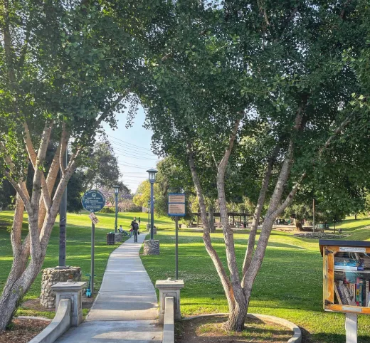 Shaded lawn and hilly path at Garfield Park in South Pasadena