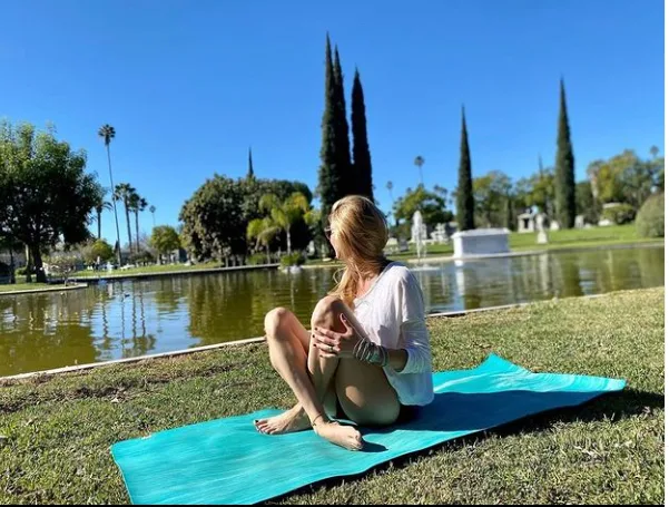 Outdoor yoga class held on the grounds of Hollywood Forever Cemetery