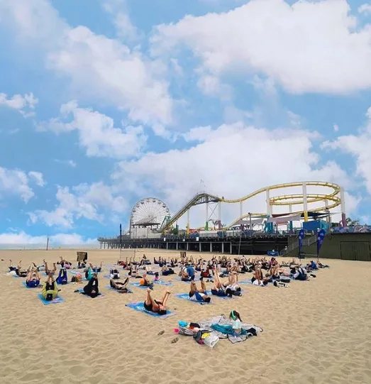 Beach yoga class on the sand in Santa Monica with Beach Yoga SoCal