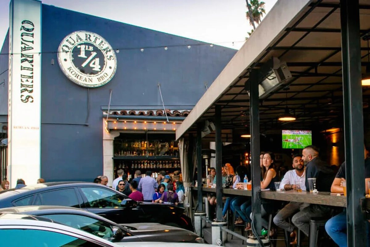 The patio at Quarters Korean BBQ filling up at Chapman Plaza in Koreatown