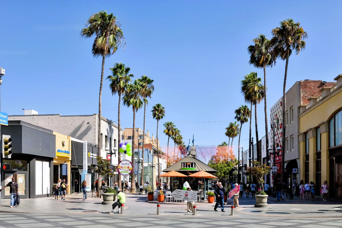Shoppers under the palms on Third Street Promenade in Santa Monica