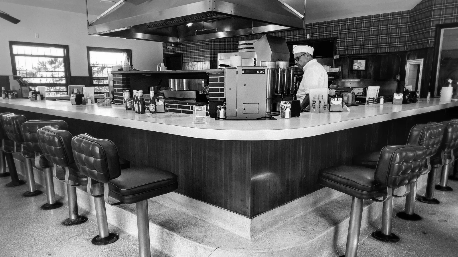 The vintage U-shaped lunch counter inside The Apple Pan diner on Pico Boulevard in West Los Angeles.