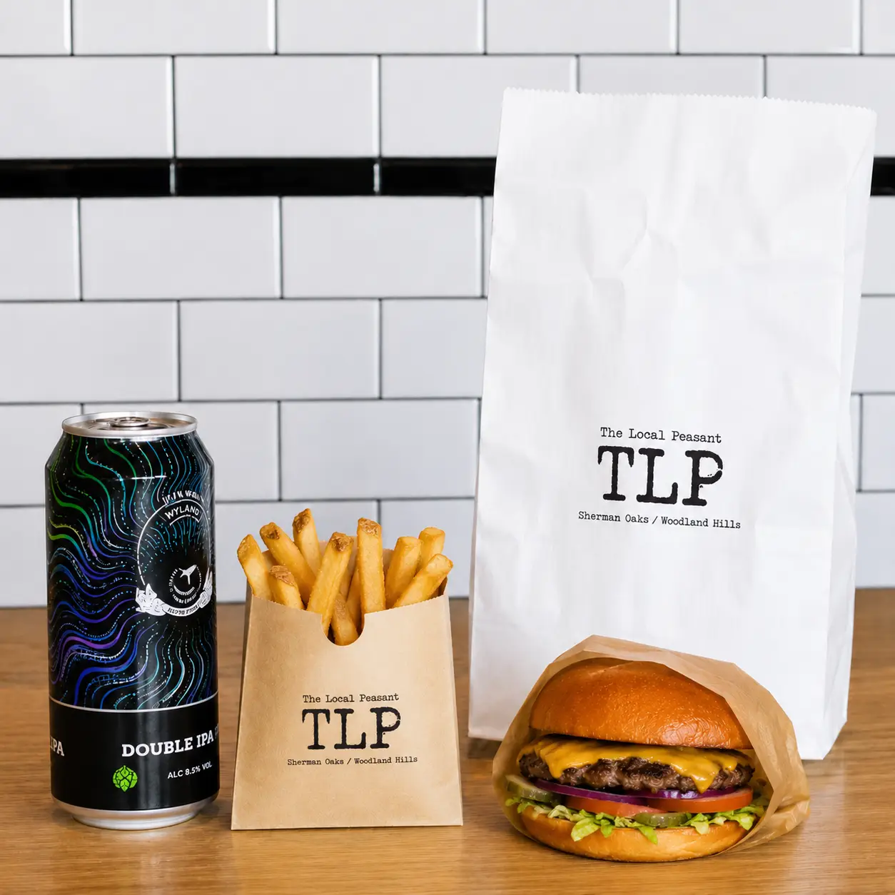 The Wagyu smash burger with fries and a beer, the “Adult Happy Meal,” at The Local Peasant in Sherman Oaks.