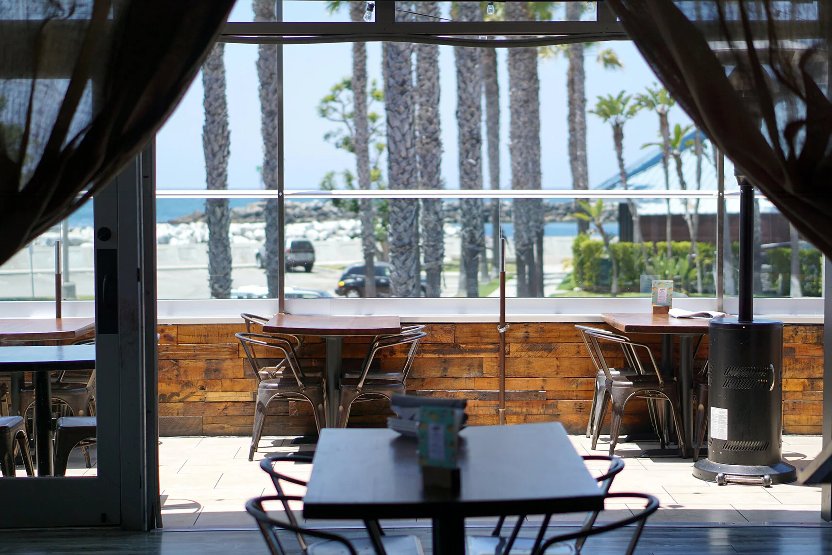 Waterfront dining room at R/10 Social House overlooking King Harbor, Redondo Beach
