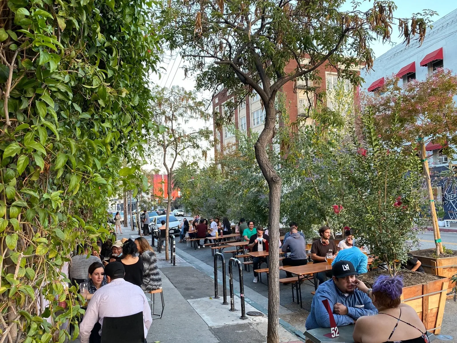 Diners gather outside Wurstküche, the Venice beer hall known for its exotic grilled sausages.