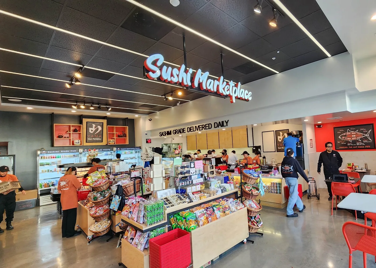 Market interior with service counters, shelving and customers