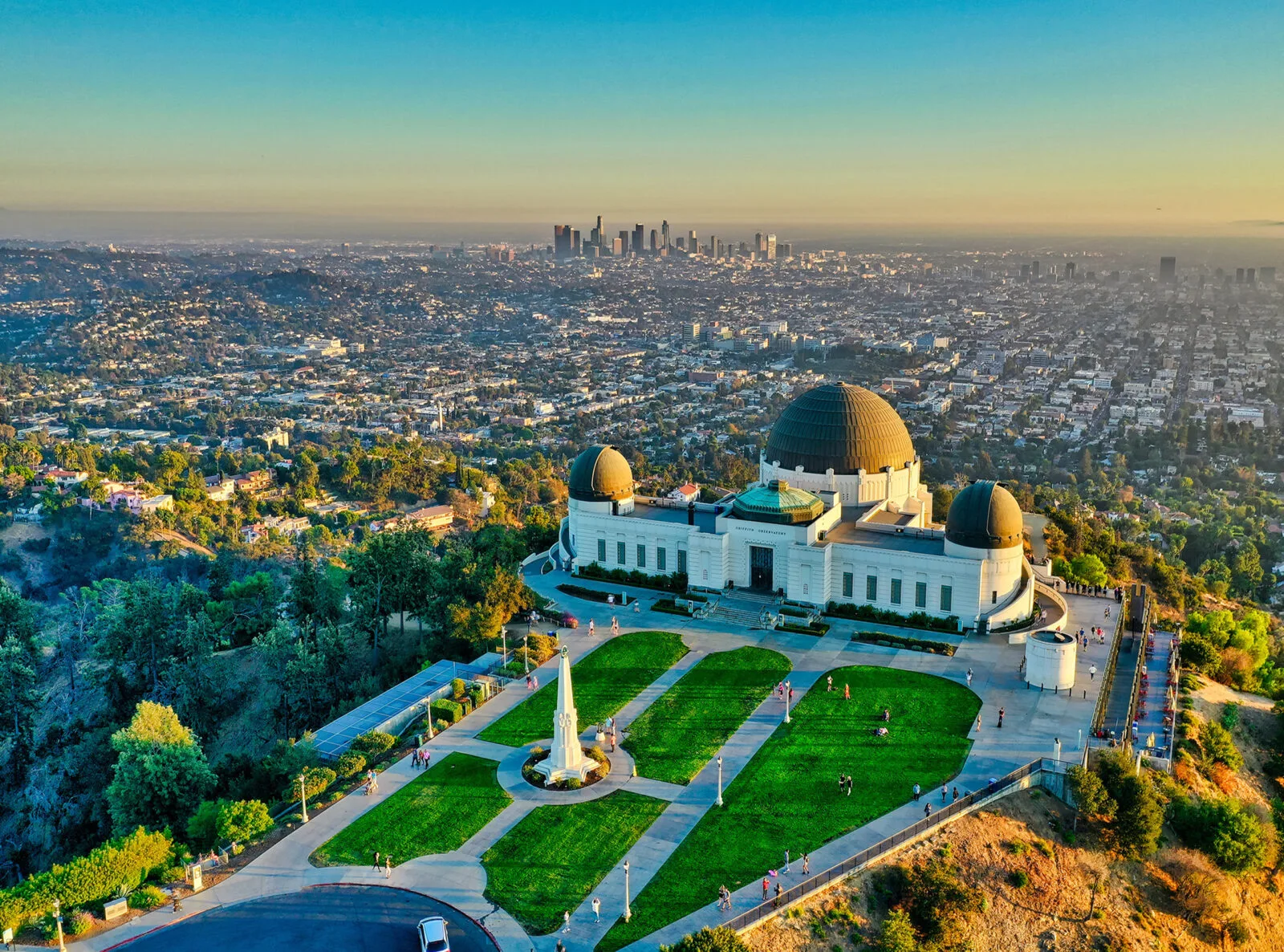 Griffith Observatory overlooking the Los Angeles skyline at sunset.
