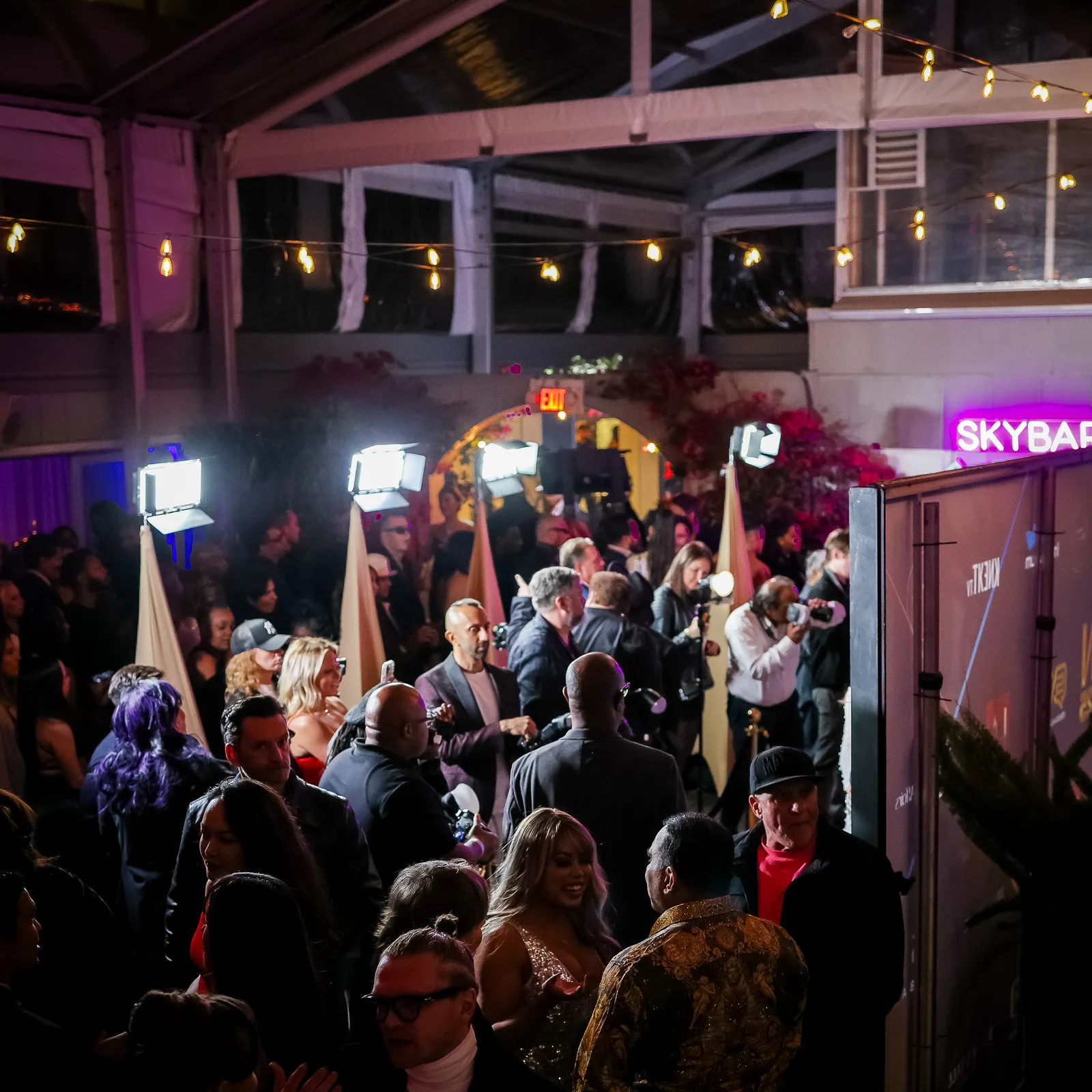 Press, photographer, and media line the golden carpet to take pictures of everyone at the Golden Globes Pre-Party in West Hollywood.