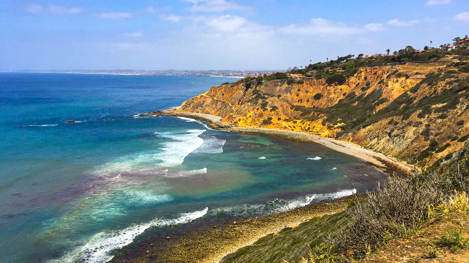 Surfers' trail descending the ocean bluffs to the rocky shoreline at Bluff Cove in Palos Verdes Estates, south of Los Angeles.