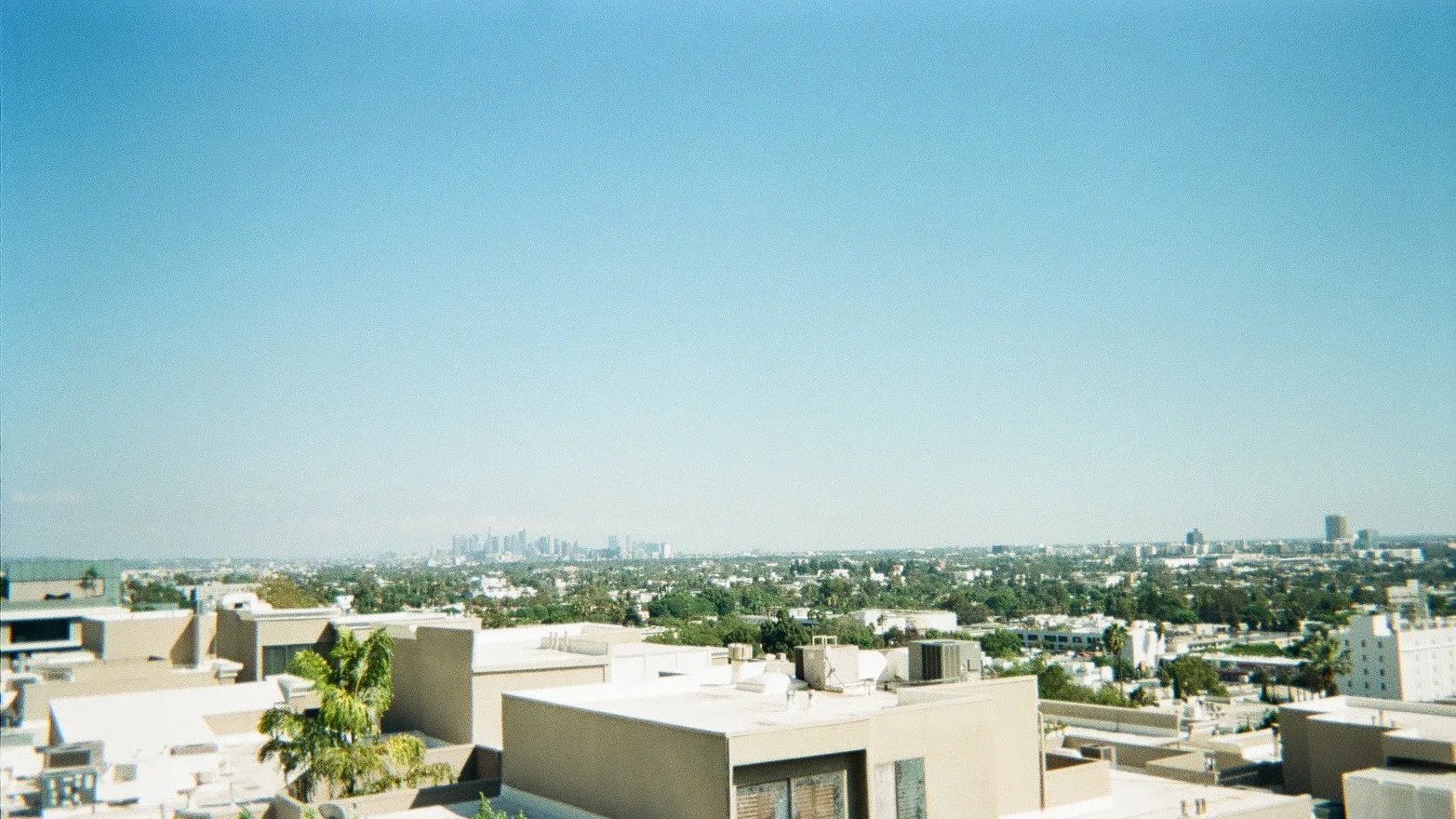 Disposable camera view from the rooftop of the Instagram Summit in West Hollywood, Los Angeles, CA to see the DTLA skyline in the distance.