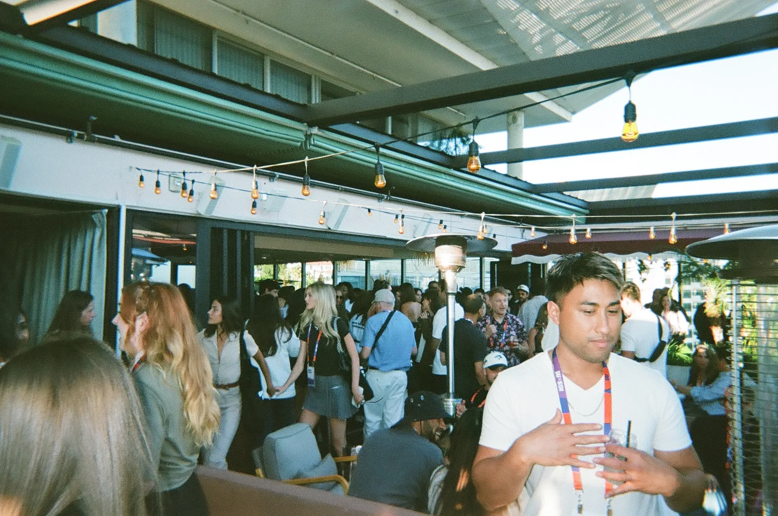 Attendees gather for the rooftop after party.