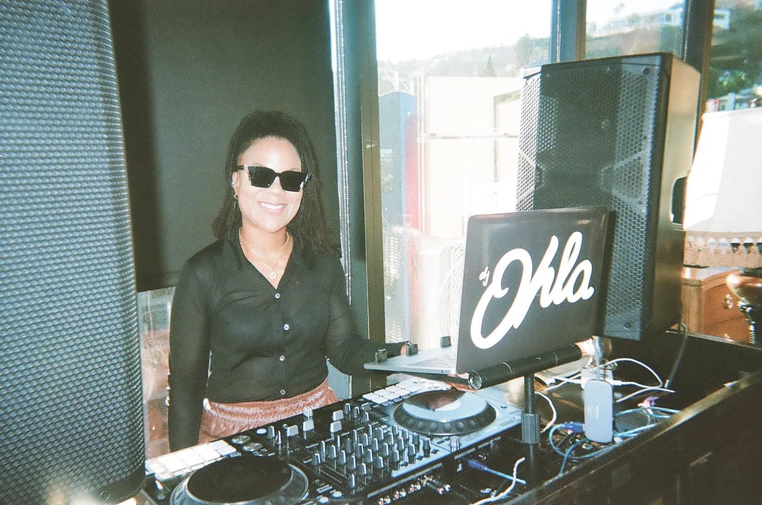DJ poses at the Instagram Summit After Party on the 1 Hotel Rooftop