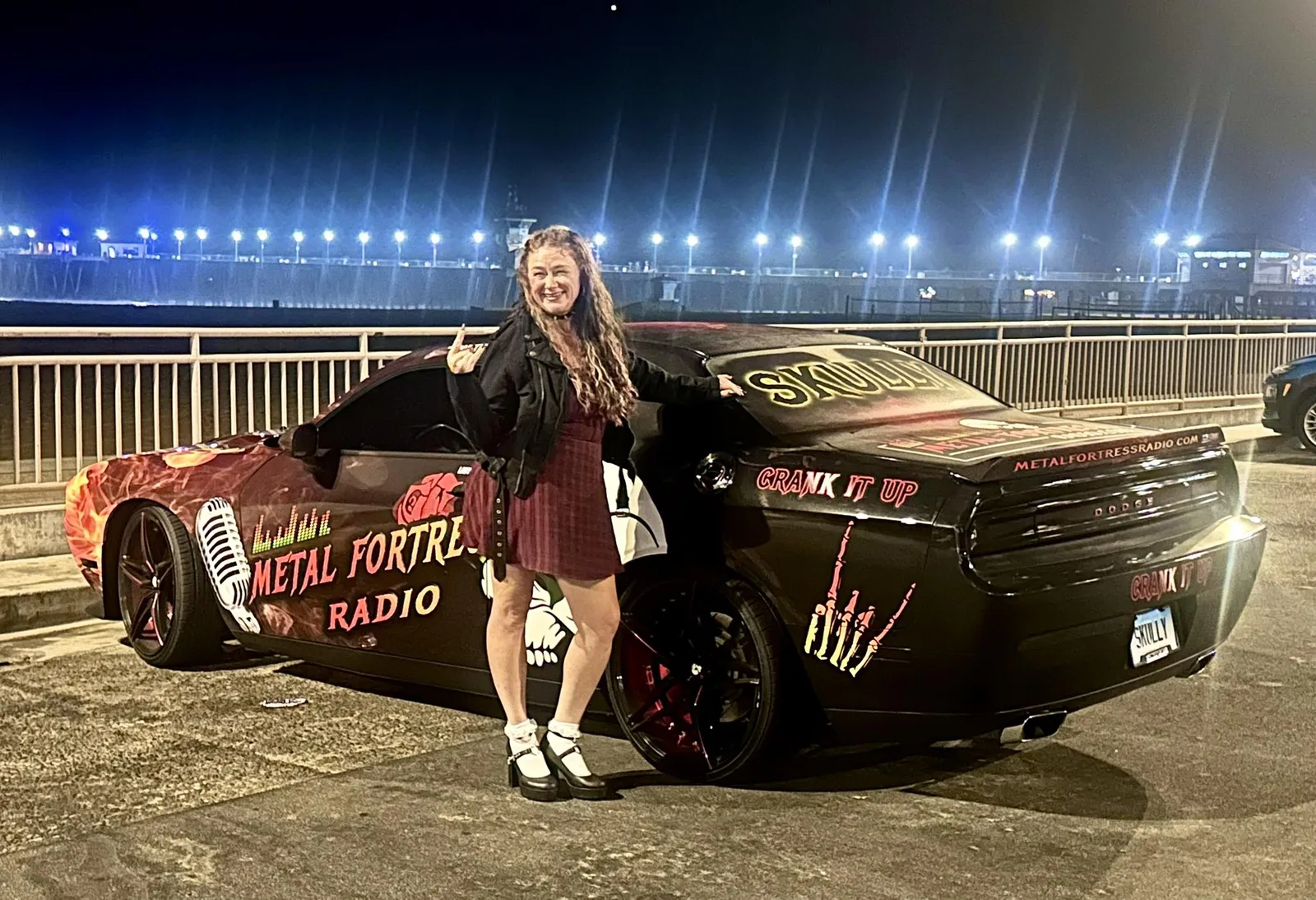Christine Blardo in front of Metal Fortress Radio Car