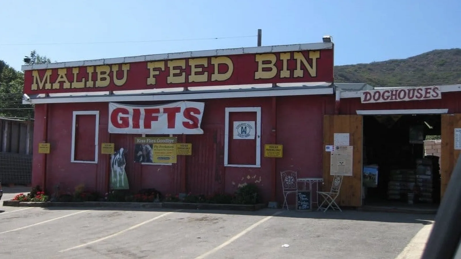 Malibu Feed Bin red building with signs in the front