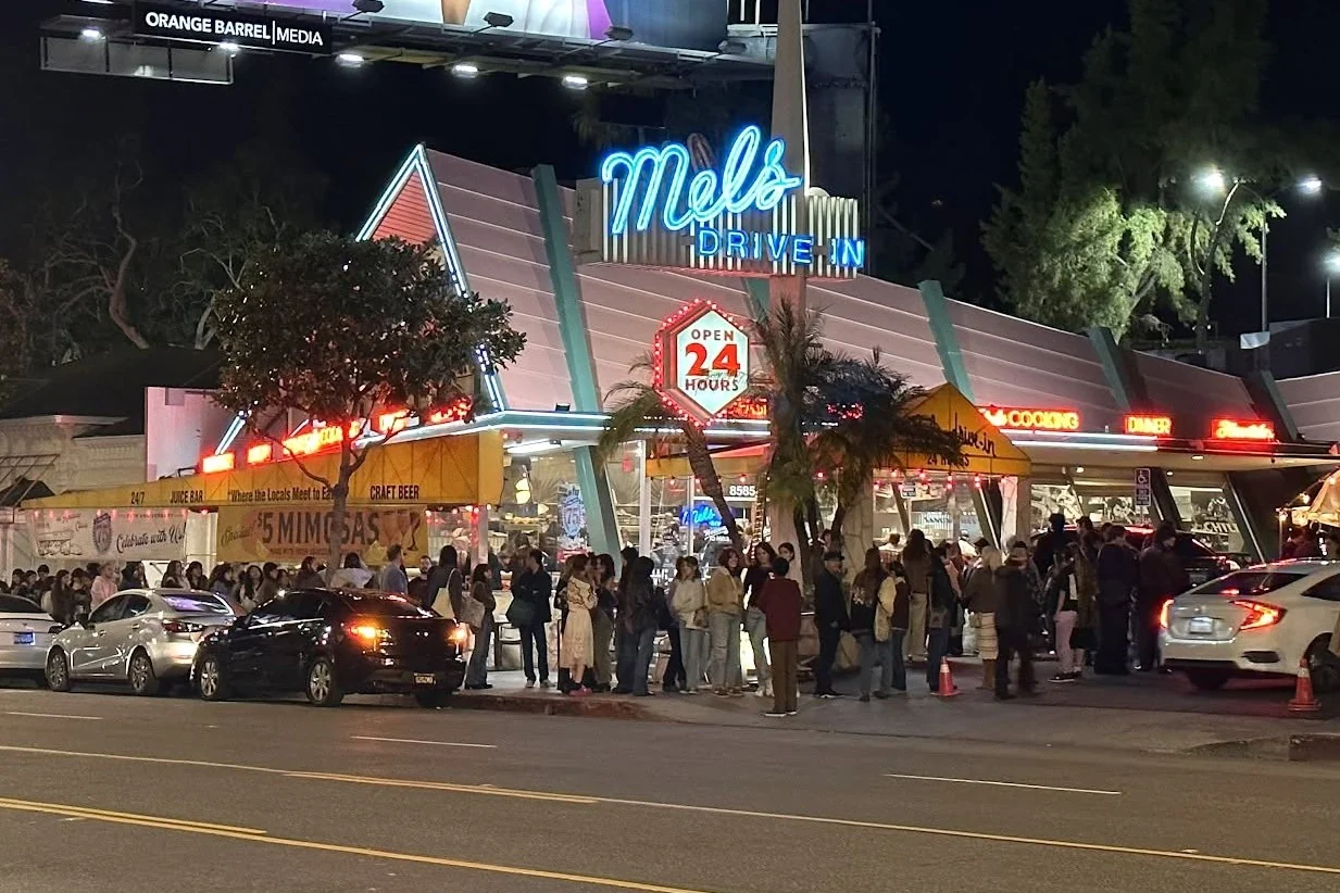 The neon-lit Mel's Drive-In storefront at night