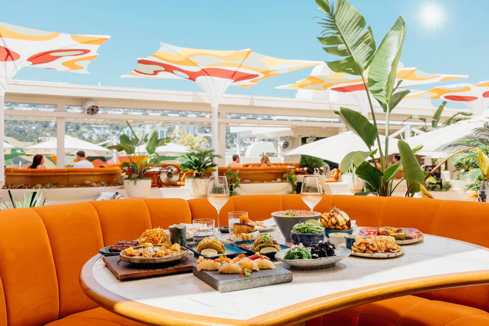 The orange banquettes and dining room at SUSHISAMBA