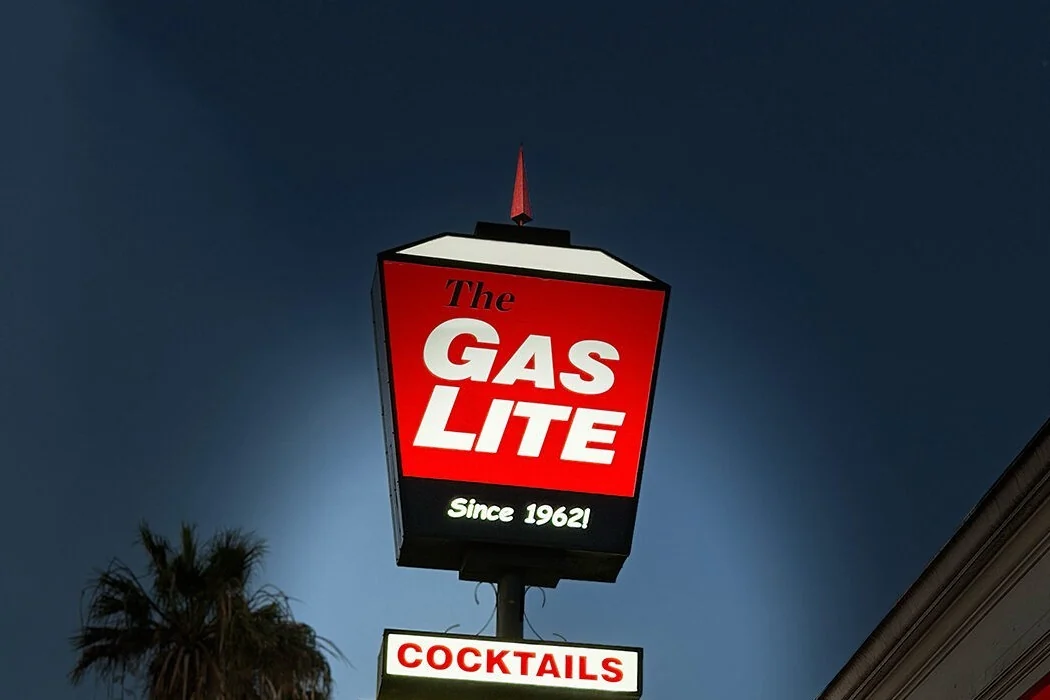 The illuminated GasLite cocktails sign against a night sky