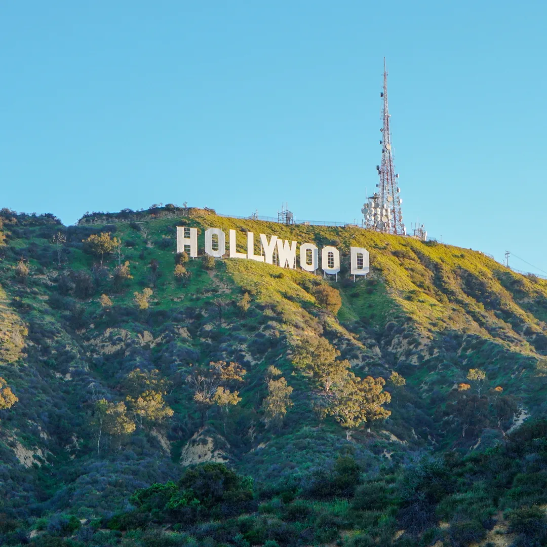 The Hollywood Sign lit by golden light on the Hollywood Hills