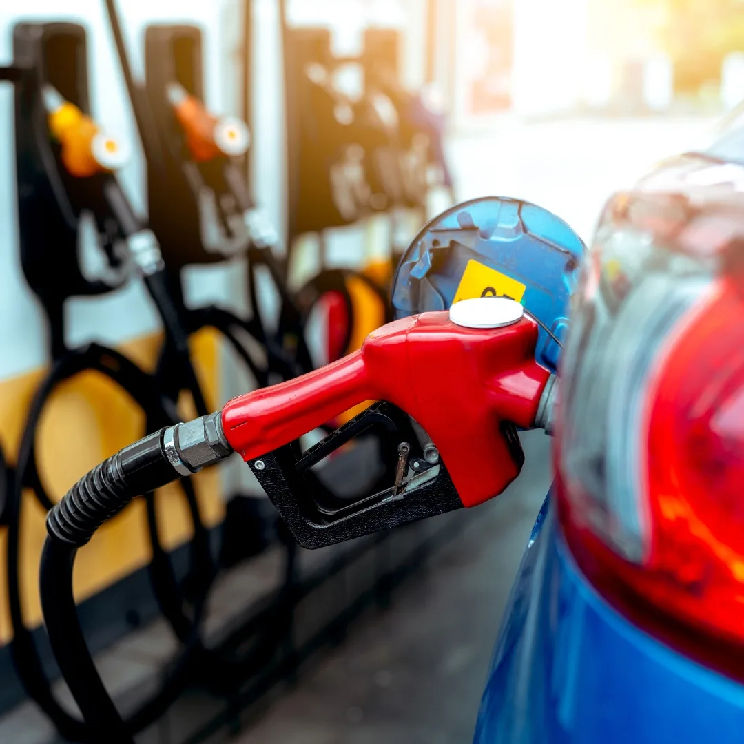 Gas pump handle plugged into a car at a Los Angeles gas station