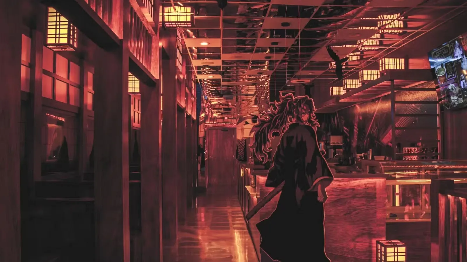 Dim red lit restaurant interior with an anime style mural along the wall