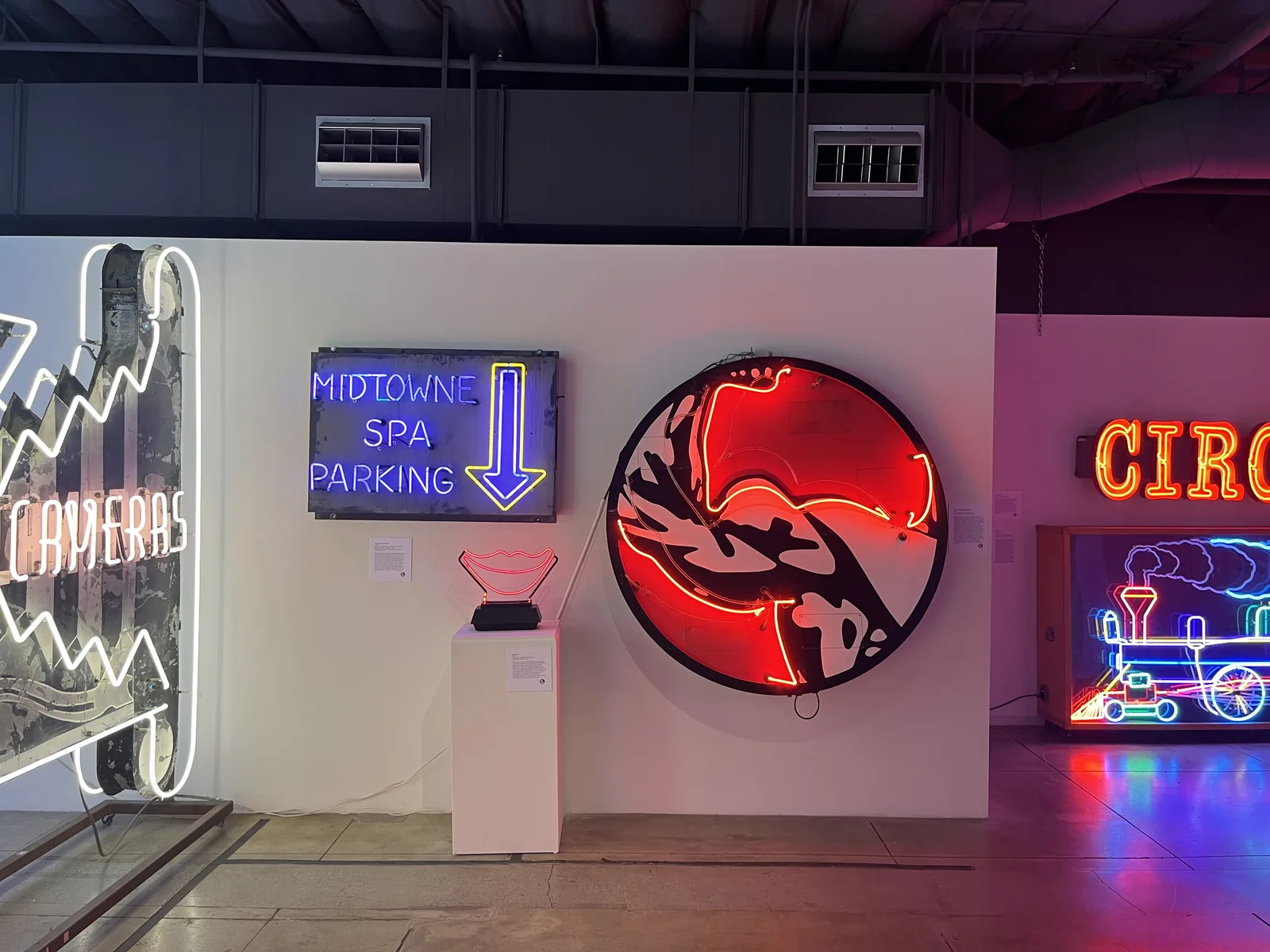 A glowing neon dragon sign at the Museum of Neon Art in Glendale