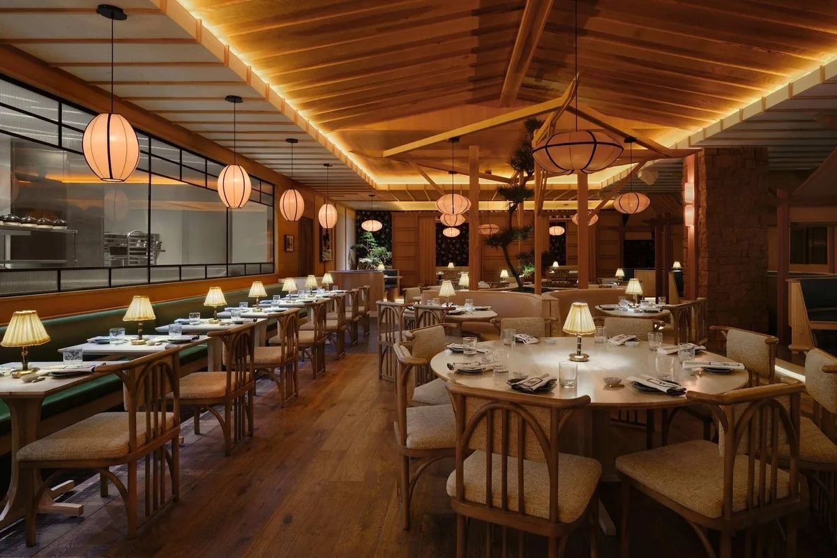 Paper lanterns and round tables in the dining room at Little Luck on the Sunset Strip