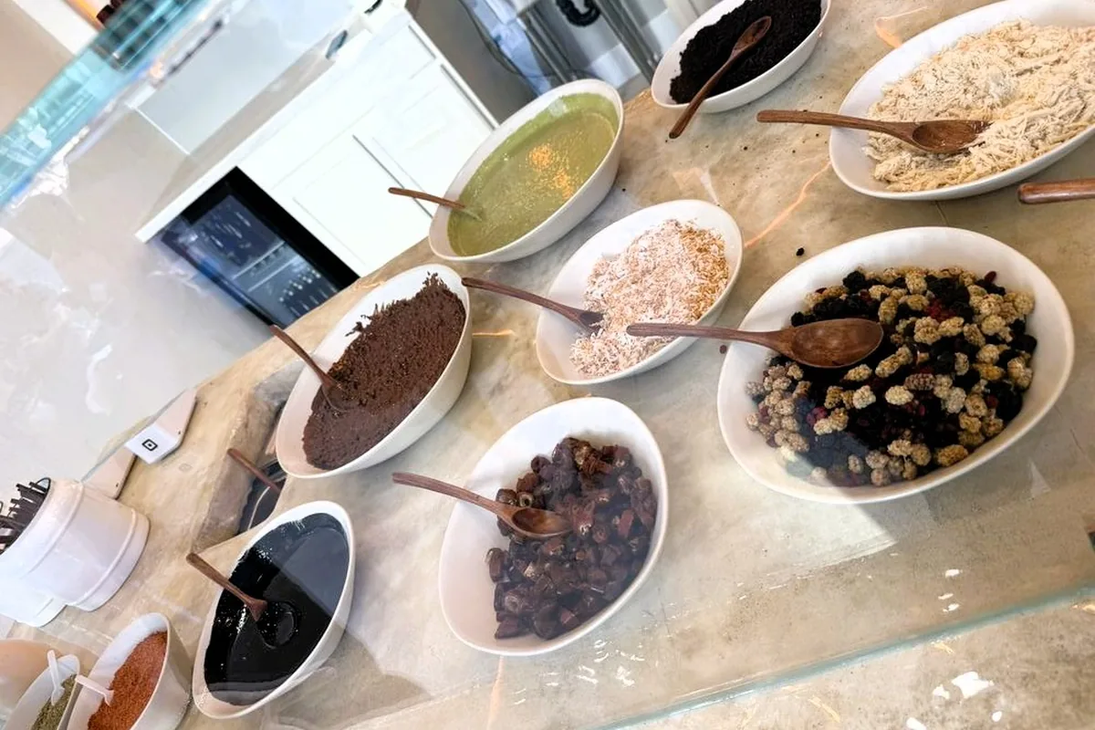 The toppings counter at Nudes Yogurt: halva, matcha, dates, dried mulberries, coconut and crushed baklava