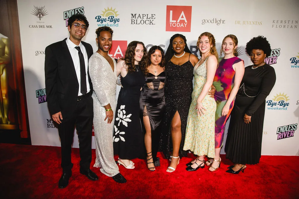 A beautifully dressed crowd poses on the red carpet for paparazzi and media at LA Today's Oscars Pre-Party at Grandmaster Recorders Los Angeles.