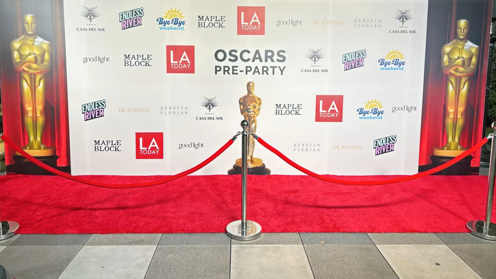 Oscars Pre-Party 2025 step and repeat setup with Oscar Statues and red carpet