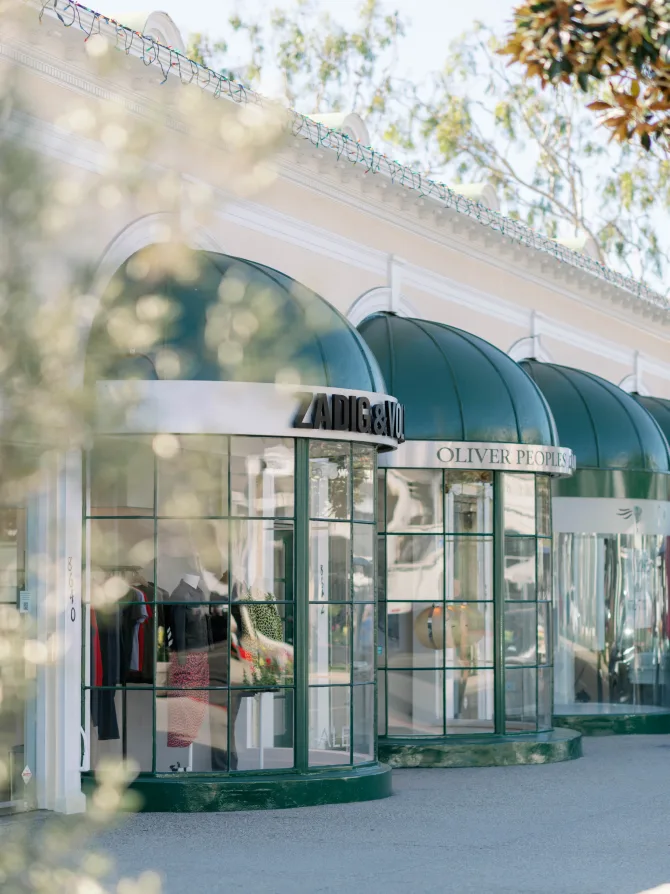 Boutique storefronts including Zadig & Voltaire and Oliver Peoples on Robertson Boulevard.