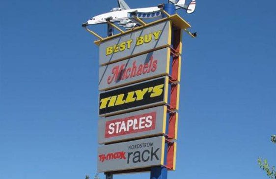 A retail pylon sign topped with an airplane at Burbank Empire Center.