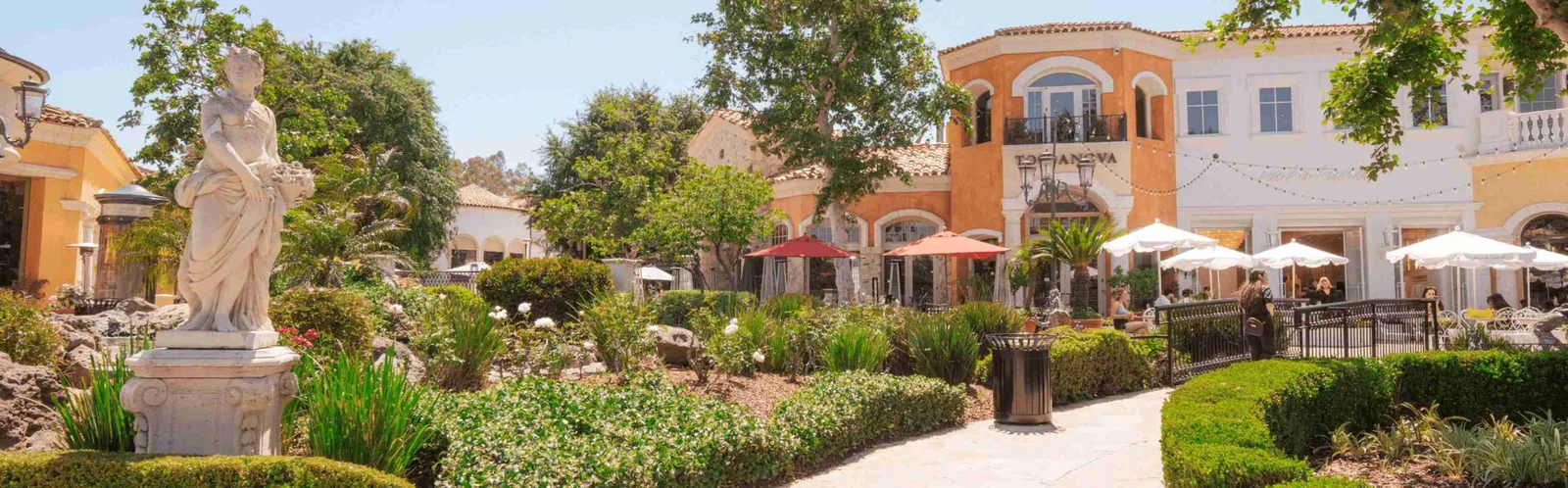 A Mediterranean-style courtyard with a fountain at The Commons at Calabasas.
