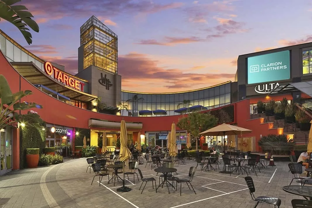 Target and ULTA signs above a patio terrace at dusk
