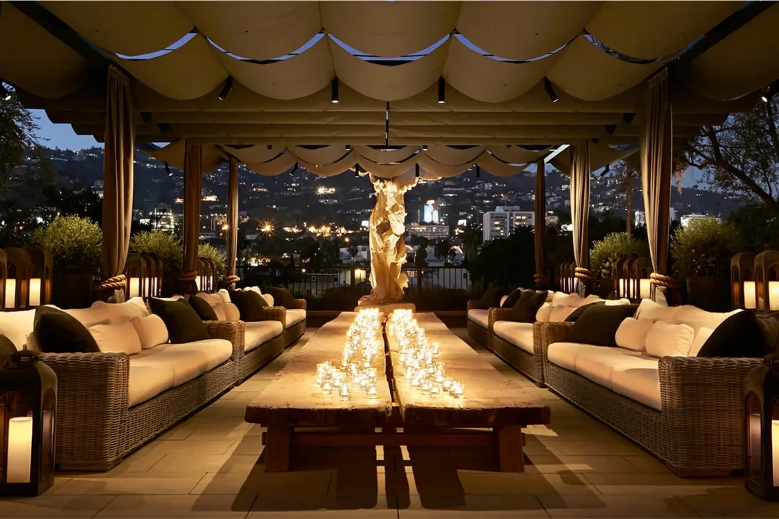 The rooftop park at RH West Hollywood seen through its century-old olive trees