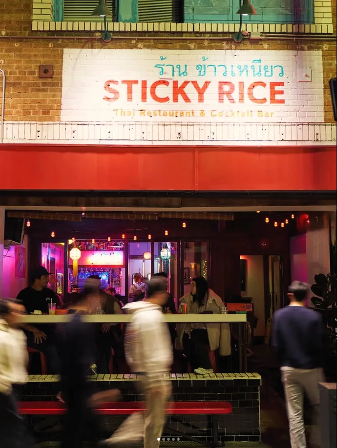 The Sticky Rice storefront in Echo Park at night, home to the Spirit House cocktail bar