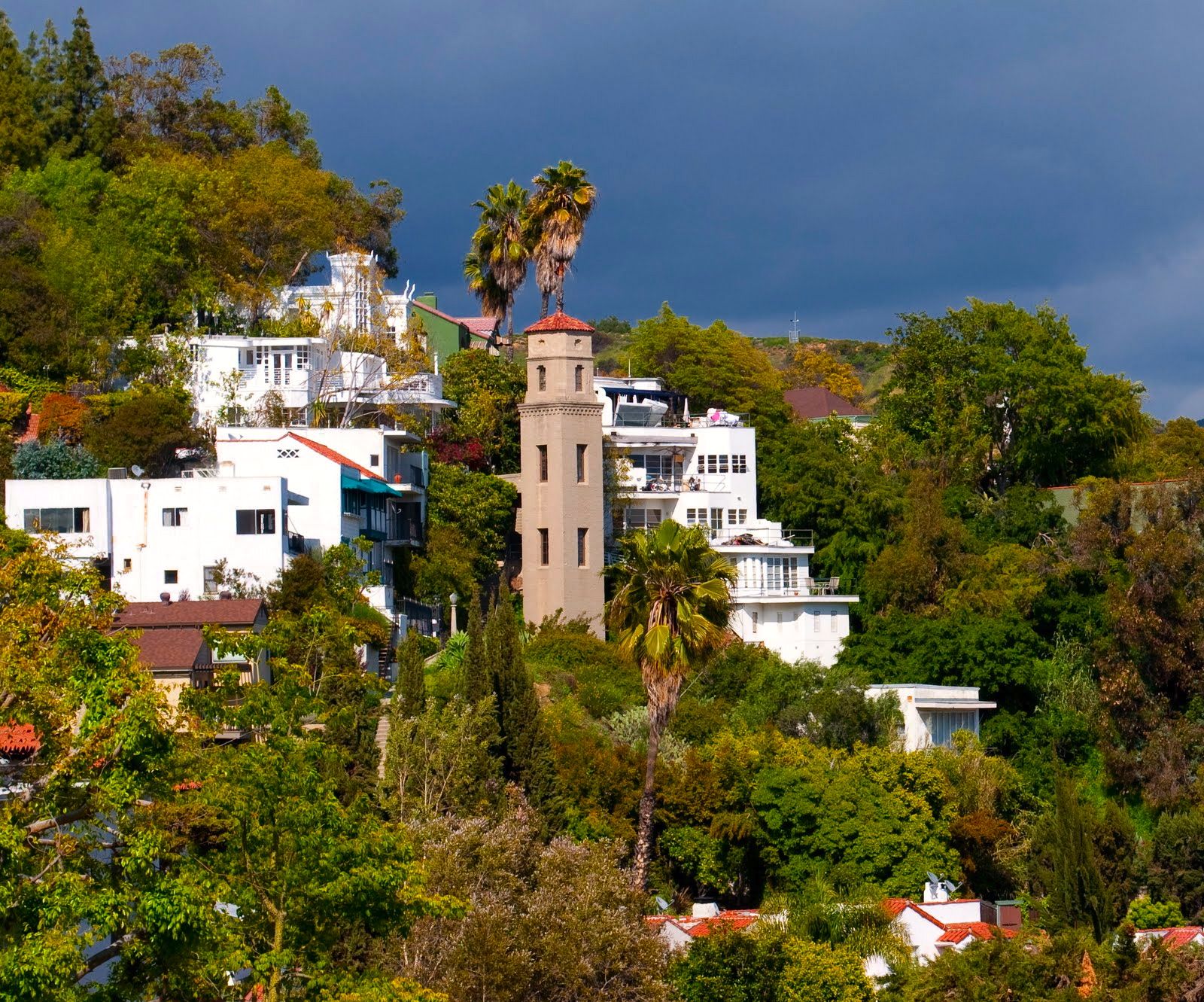 Hillside view of the historic High Tower elevator structure surrounded by Hollywood Hills homes.