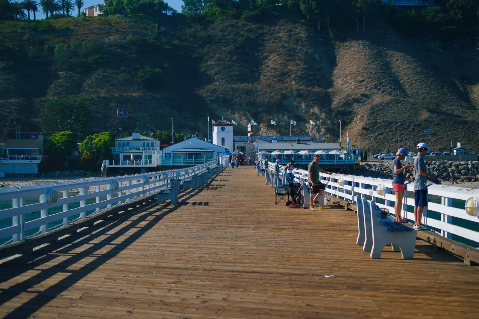 The wooden walkway of Malibu Pier leading to Malibu Farm