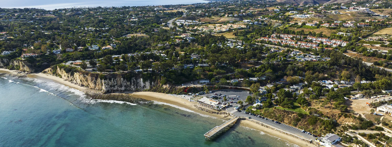 Aerial of the sheltered Paradise Cove and its beach
