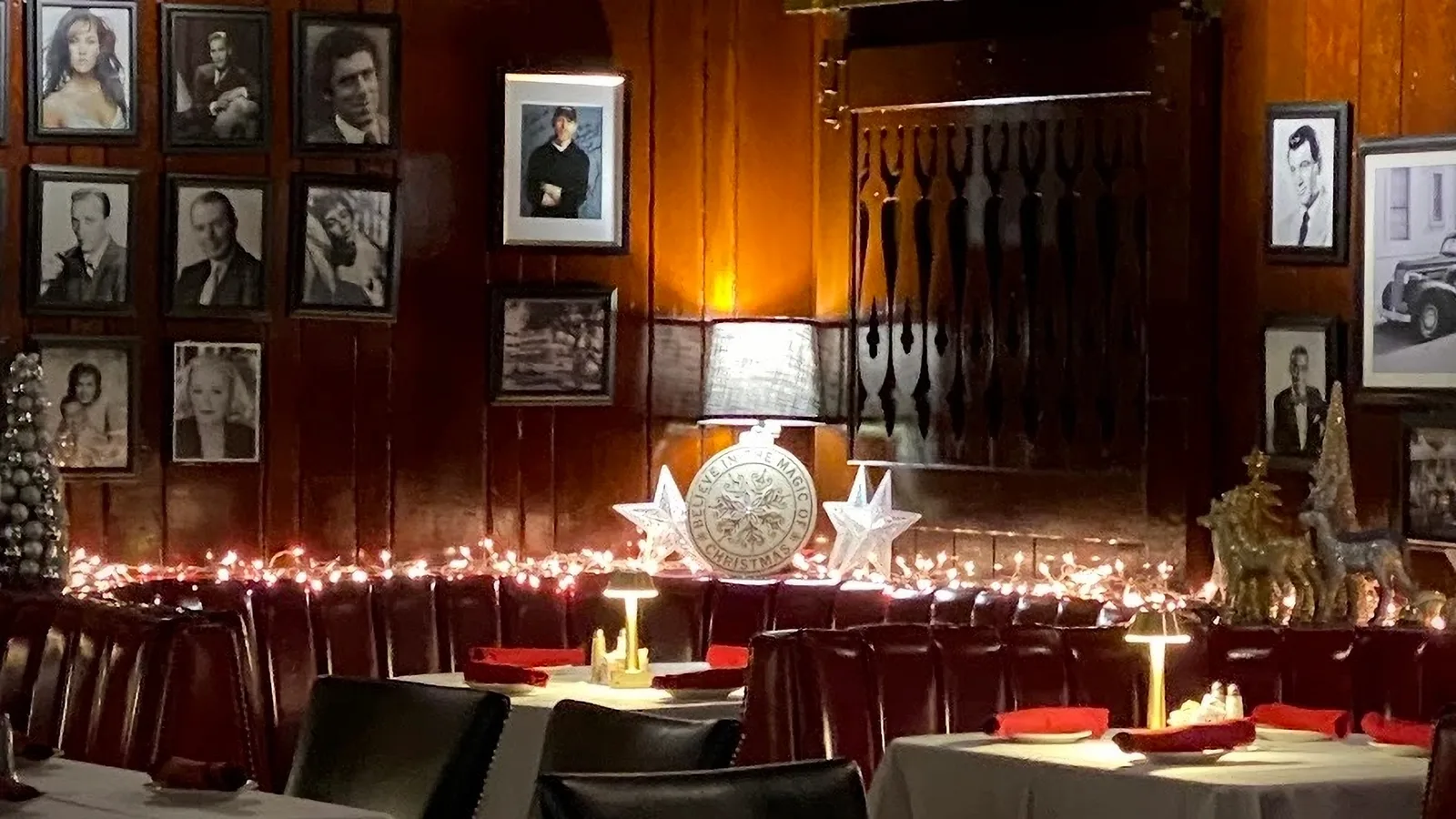 Walls of framed photos of famous patrons inside the Smoke House