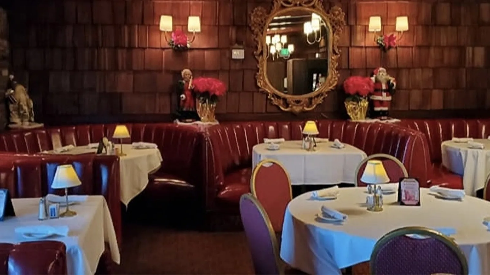Red leather booths and wood paneling in the Smoke House dining room